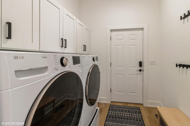 1 N Beverly Ln, Arlington Heights, IL 60004 - laundry area featuring washing machine and clothes dryer, light wood-type flooring, and cabinet space