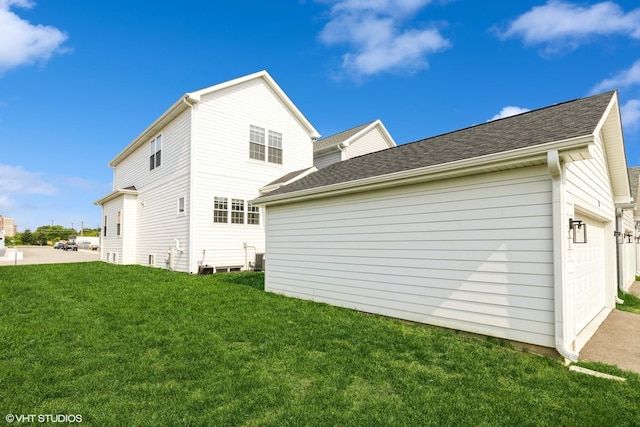 1 N Beverly Ln, Arlington Heights, IL 60004 - back of house featuring a yard, a garage, and roof with shingles