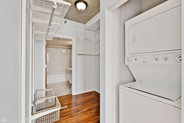 1845 S Michigan Ave Unit 1602, Chicago, IL 60616 - laundry room featuring estacked washer and dryer and wood finished floors