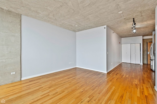 1845 S Michigan Ave Unit 1602, Chicago, IL 60616 - unfurnished room with wood finished floors and baseboards