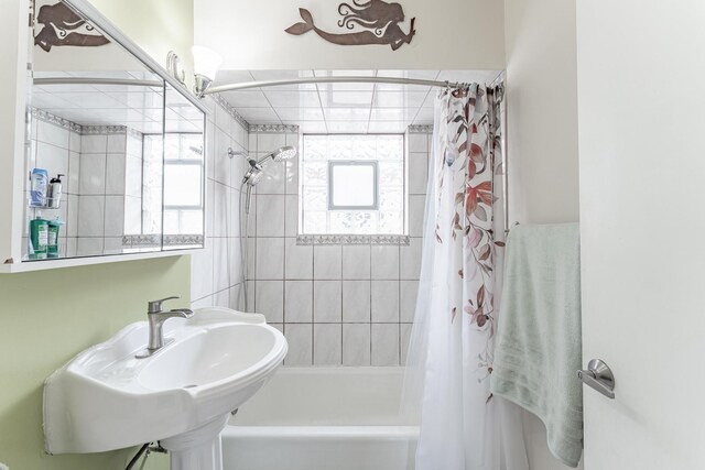 3631 54th Ave, Cicero, IL 60804 - bathroom featuring shower / bathtub combination with curtain and a sink