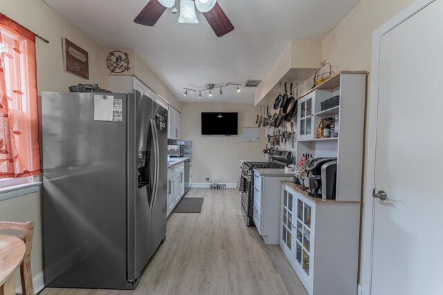 3631 54th Ave, Cicero, IL 60804 - kitchen with stainless steel appliances, light wood-type flooring, ceiling fan, white cabinetry, and light countertops
