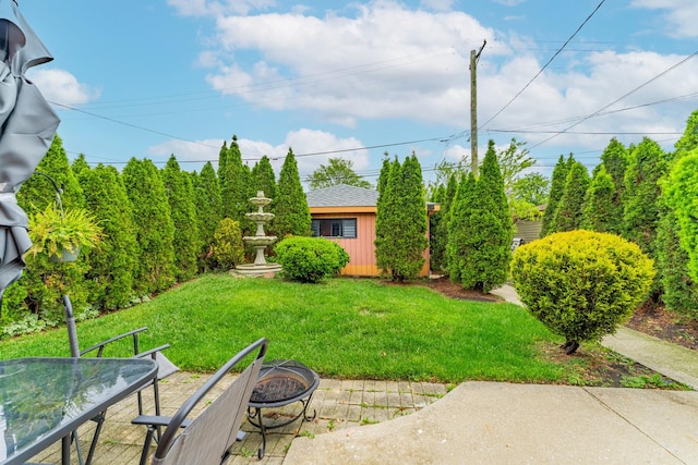 3631 54th Ave, Cicero, IL 60804 - view of grassy yard featuring a fire pit and a patio