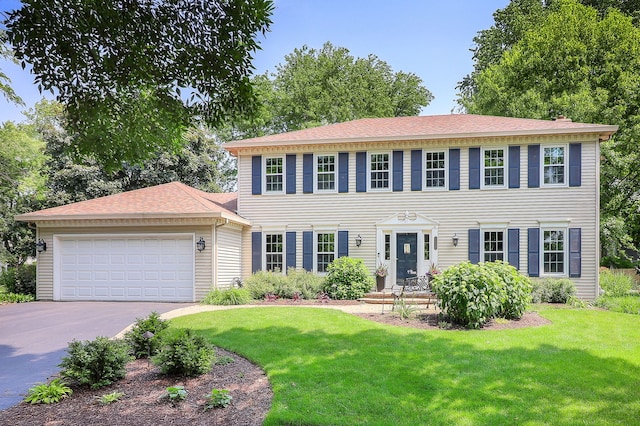 1549 Preston Rd, Naperville, IL 60563 - colonial home featuring an attached garage, driveway, a front lawn, and roof with shingles