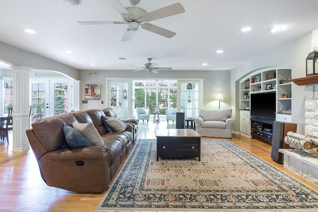 1549 Preston Rd, Naperville, IL 60563 - living room featuring light wood-style flooring, ceiling fan, recessed lighting, decorative columns, and built in shelves