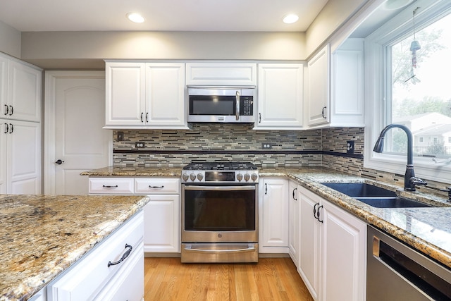 1549 Preston Rd, Naperville, IL 60563 - kitchen featuring stainless steel appliances, decorative backsplash, white cabinetry, light stone countertops, and recessed lighting
