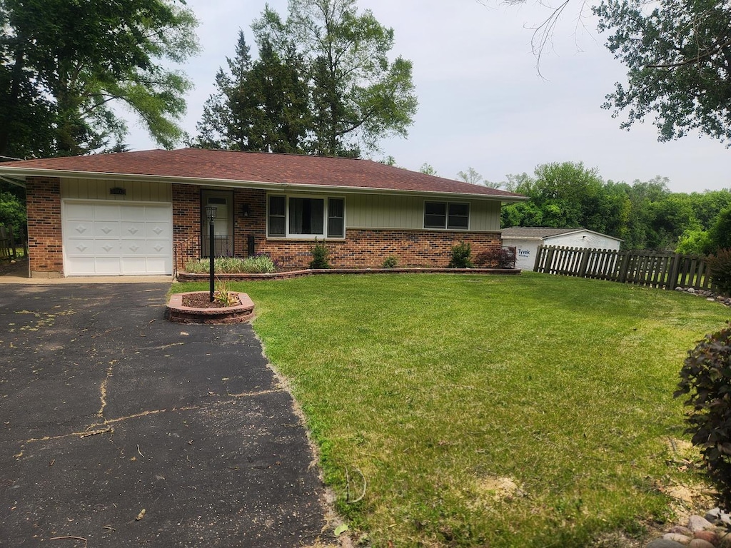 5902 Fox Lake Rd, Mchenry, IL 60051 - ranch-style house featuring brick siding, an attached garage, and driveway