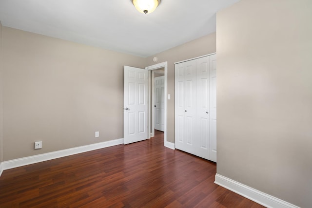 5902 Fox Lake Rd, Mchenry, IL 60051 - unfurnished bedroom with dark wood finished floors and a closet