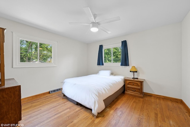 345 Catalpa Ave, Roselle, IL 60172 - bedroom with light wood-type flooring and a ceiling fan