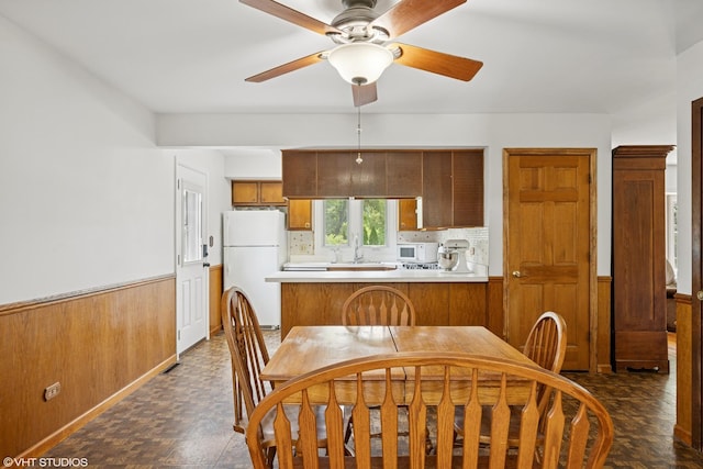 345 Catalpa Ave, Roselle, IL 60172 - kitchen with white appliances, ceiling fan, brown cabinets, light countertops, and a peninsula