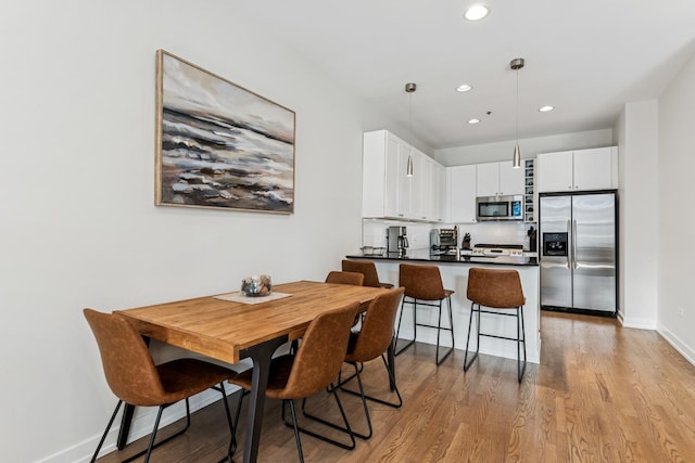 150 W Superior St Unit 1103, Chicago, IL 60654 - dining space with recessed lighting and light wood-style flooring