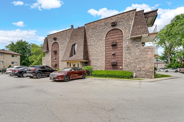 18340 Glen Oak Ave Unit 1D, Lansing, IL 60438 - view of building exterior featuring uncovered parking
