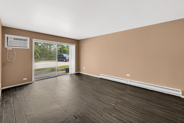 18340 Glen Oak Ave Unit 1D, Lansing, IL 60438 - spare room featuring a baseboard heating unit, a wall mounted air conditioner, and dark wood-type flooring