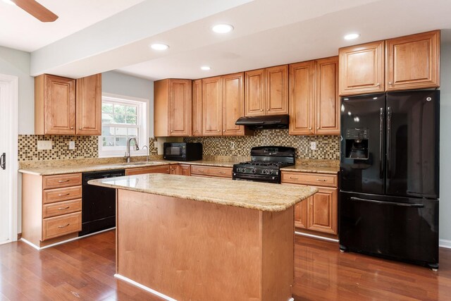 5087 Wilderness Trl, Rockford, IL 61114 - kitchen featuring black appliances, under cabinet range hood, dark wood finished floors, decorative backsplash, and recessed lighting