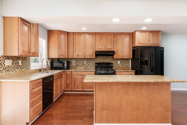 5087 Wilderness Trl, Rockford, IL 61114 - kitchen featuring black appliances, under cabinet range hood, dark wood-type flooring, a center island, and recessed lighting