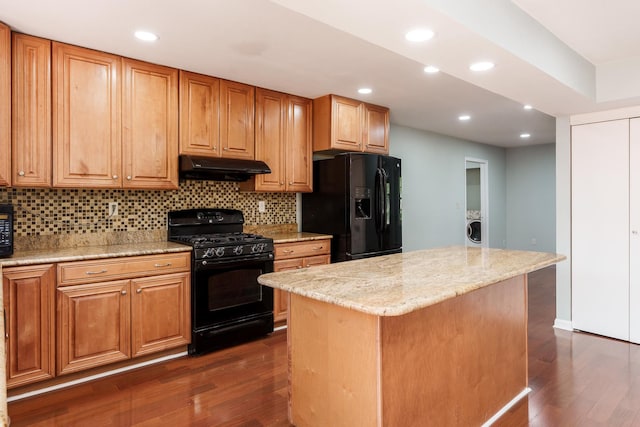 5087 Wilderness Trl, Rockford, IL 61114 - kitchen with black appliances, under cabinet range hood, dark wood-type flooring, backsplash, and recessed lighting