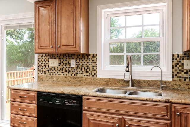 5087 Wilderness Trl, Rockford, IL 61114 - kitchen with black dishwasher, decorative backsplash, brown cabinets, and light stone counters