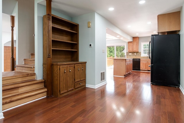 5087 Wilderness Trl, Rockford, IL 61114 - kitchen with black appliances, dark wood-style floors, recessed lighting, light countertops, and backsplash