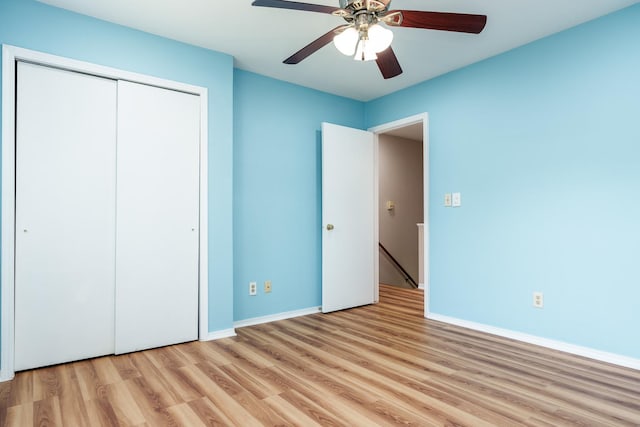 5087 Wilderness Trl, Rockford, IL 61114 - unfurnished bedroom featuring light wood-style floors, a closet, and a ceiling fan