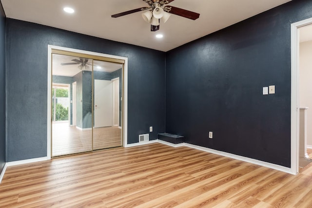 5087 Wilderness Trl, Rockford, IL 61114 - unfurnished room with light wood-style floors, ceiling fan, a textured wall, and recessed lighting