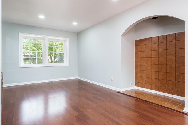5087 Wilderness Trl, Rockford, IL 61114 - spare room with dark wood-style floors, recessed lighting, and arched walkways