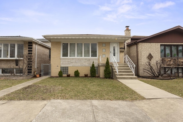 4567 N Merrimac Ave, Chicago, IL 60630 - view of front of house with a gate, a front yard, a chimney, and brick siding