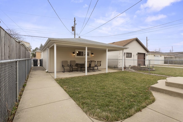 4567 N Merrimac Ave, Chicago, IL 60630 - rear view of house featuring a fenced backyard and a patio area