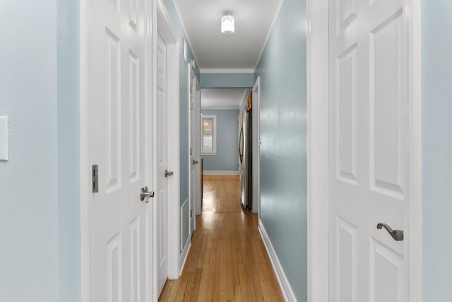 4567 N Merrimac Ave, Chicago, IL 60630 - corridor with light wood-style floors and crown molding