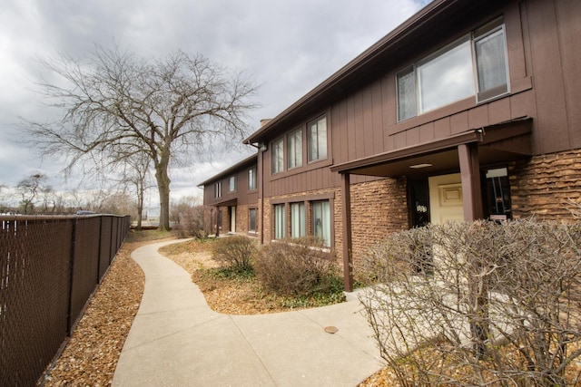 107 65th Lake Dr Unit 202, Westmont, IL 60559 - view of side of property with board and batten siding and brick siding