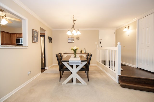 107 65th Lake Dr Unit 202, Westmont, IL 60559 - dining room featuring light colored carpet, a chandelier, crown molding, and a ceiling fan