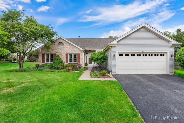 6 Ennis Ct, Cary, IL 60013 - single story home with asphalt driveway, an attached garage, a front lawn, and brick siding