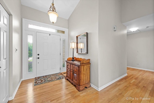6 Ennis Ct, Cary, IL 60013 - entrance foyer with light wood-style flooring and high vaulted ceiling