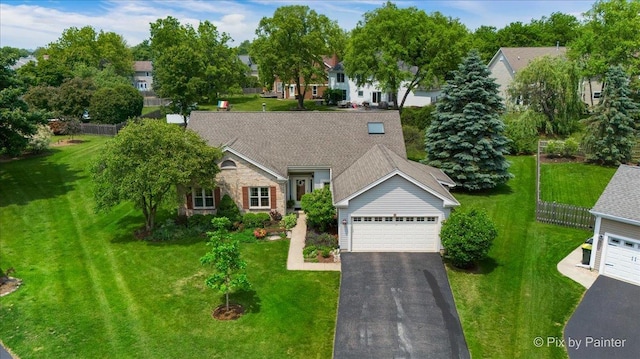 6 Ennis Ct, Cary, IL 60013 - view of front facade featuring a garage, a front lawn, and asphalt driveway