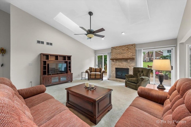 6 Ennis Ct, Cary, IL 60013 - carpeted living area with high vaulted ceiling, ceiling fan, a fireplace, a skylight, and recessed lighting