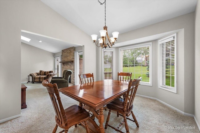 6 Ennis Ct, Cary, IL 60013 - dining room with light carpet, a chandelier, vaulted ceiling, and healthy amount of natural light