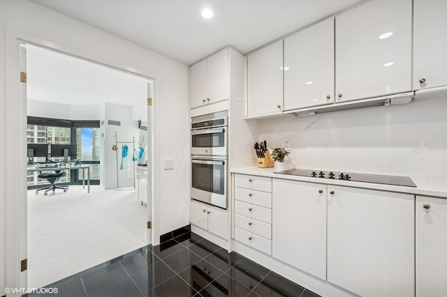 100 E Huron St Unit 3501, Chicago, IL 60611 - kitchen with black electric stovetop, stainless steel double oven, white cabinets, an office area, and recessed lighting