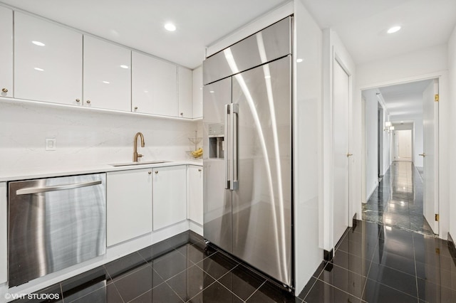 100 E Huron St Unit 3501, Chicago, IL 60611 - kitchen featuring stainless steel appliances, granite tiled floors, white cabinetry, and recessed lighting
