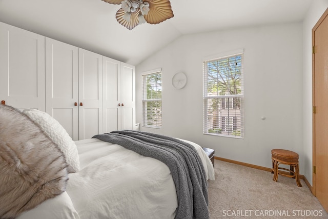 802 Symphony Dr, Aurora, IL 60504 - bedroom featuring vaulted ceiling, light carpet, ceiling fan, and a closet
