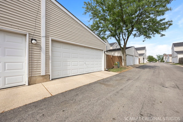 802 Symphony Dr, Aurora, IL 60504 - garage with a residential view