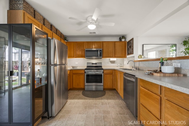 802 Symphony Dr, Aurora, IL 60504 - kitchen with stainless steel appliances, backsplash, light countertops, and plenty of natural light