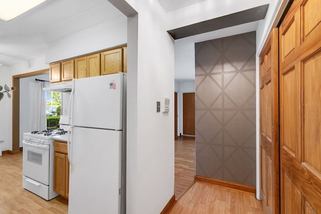 6540 W 94th Pl Unit 1A, Oak Lawn, IL 60453 - kitchen with white appliances, light wood-type flooring, and under cabinet range hood