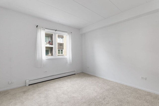 6540 W 94th Pl Unit 1A, Oak Lawn, IL 60453 - empty room with a baseboard radiator and carpet