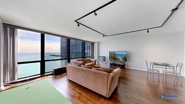 910 N Lake Shore Dr Unit 2317, Chicago, IL 60611 - living area featuring dark wood-style flooring, rail lighting, and expansive windows