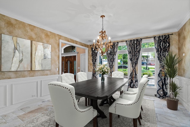 1325 Westley Ln, West Dundee, IL 60118 - dining space with stone tile floors, a decorative wall, a chandelier, crown molding, and a wainscoted wall