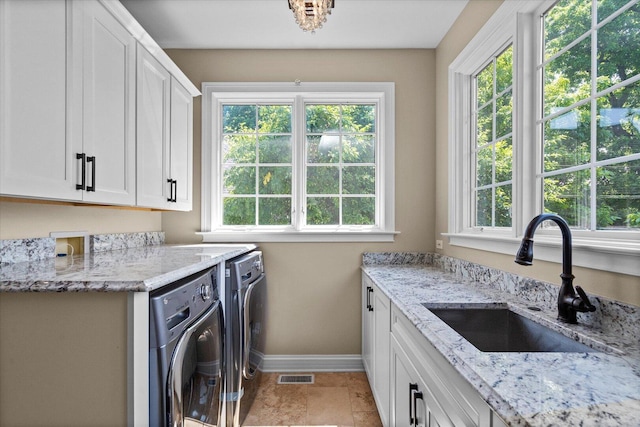 1325 Westley Ln, West Dundee, IL 60118 - washroom with cabinet space, separate washer and dryer, and plenty of natural light