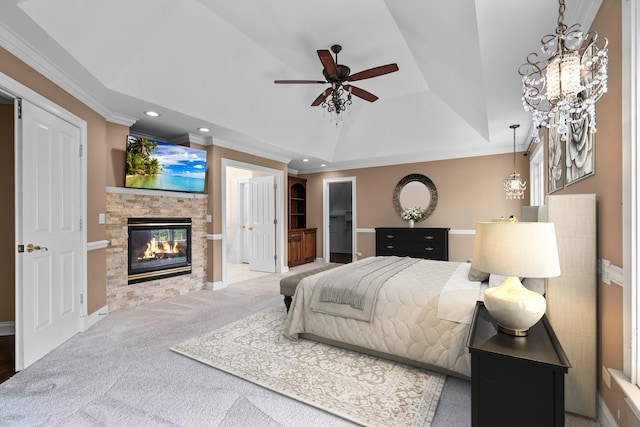 1325 Westley Ln, West Dundee, IL 60118 - bedroom with a tray ceiling, crown molding, a glass covered fireplace, recessed lighting, and carpet flooring