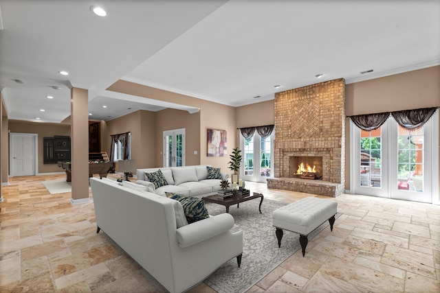 1325 Westley Ln, West Dundee, IL 60118 - living area featuring stone tile flooring, ornamental molding, recessed lighting, and a brick fireplace