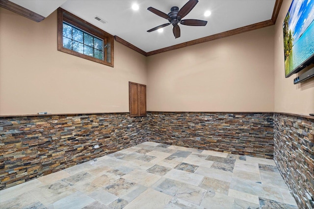 1325 Westley Ln, West Dundee, IL 60118 - spare room featuring ceiling fan, ornamental molding, recessed lighting, and stone finish flooring
