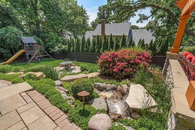 1325 Westley Ln, West Dundee, IL 60118 - fenced backyard with a playground and a patio area
