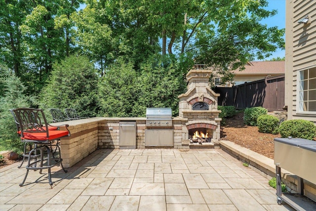 1325 Westley Ln, West Dundee, IL 60118 - view of patio / terrace featuring an outdoor kitchen and an outdoor stone fireplace